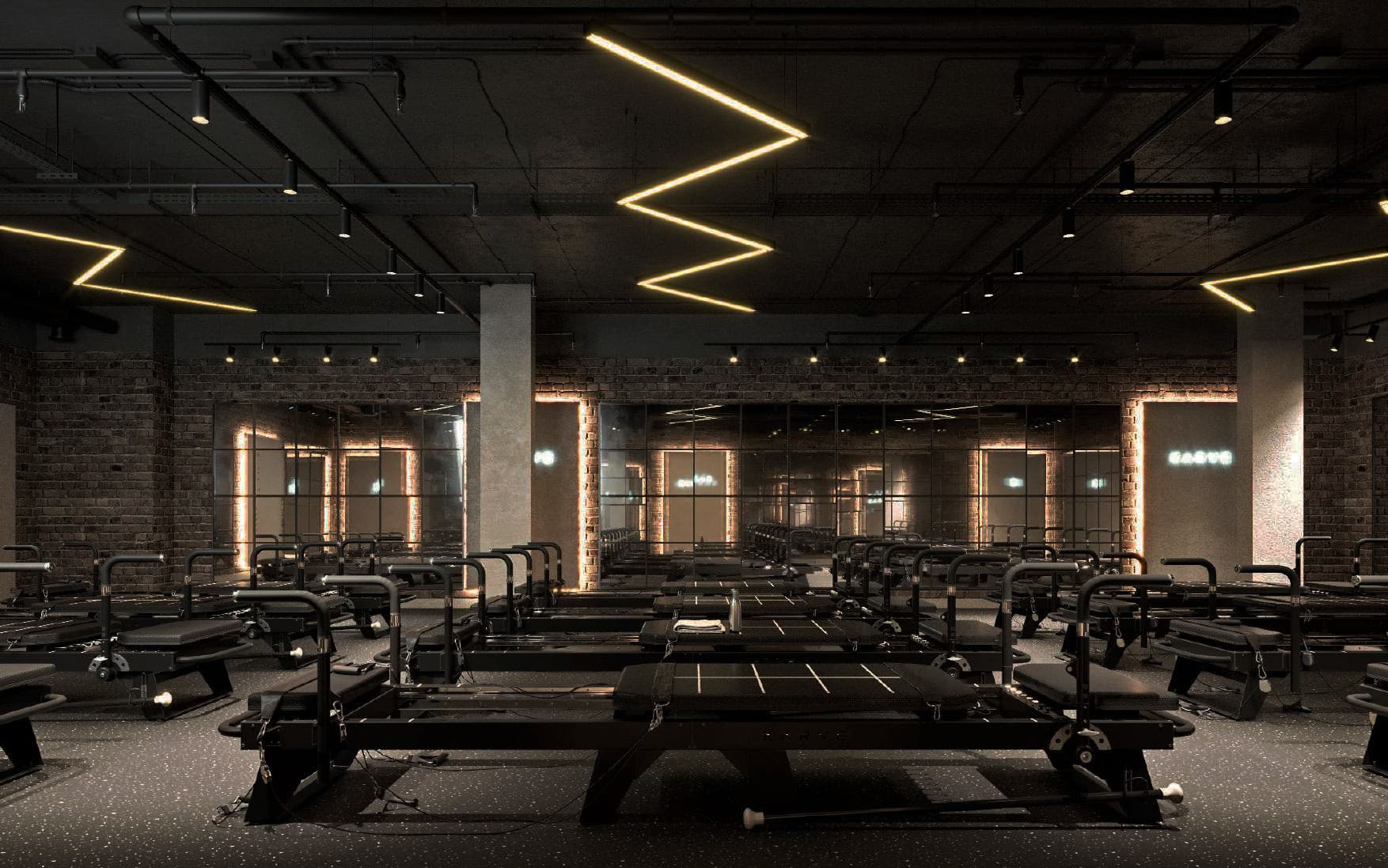 The KARVE studio — Transformer Pilates machines under signature lighting